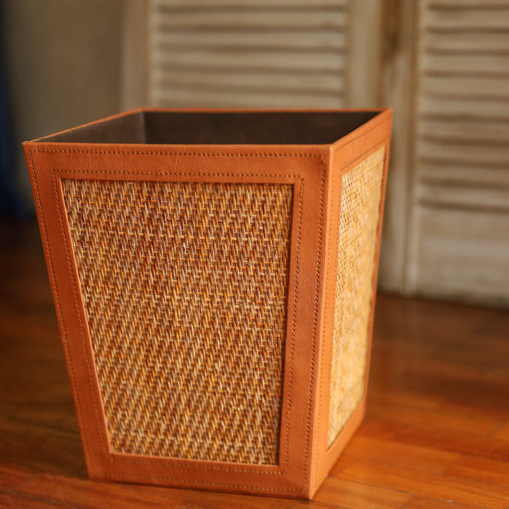 Our trash bin adds a natural touch to your bathroom while keeping it clean at all times.  Made in the Philippines from woven rattan mat and faux leather material.