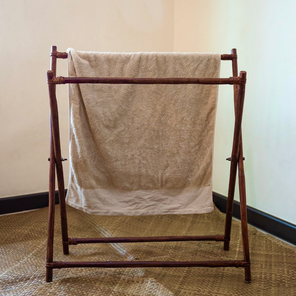 The Soraya Rattan Standing Towel Rack provides maximum space to store and dry your wet towel after a long hot bath. This foldable rack is a space-saving solution for limited bathroom spaces. Handcrafted in the Philippines from rattan material. 