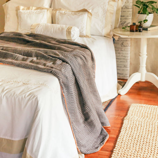 Add a cozy layer of warmth to your bed in a variety of earthy neutral tones. Made from hand-loomed polyester cotton. Each bedspread is adorned with meticulously hand-crocheted trimmings. Lovingly made in the Philippines.