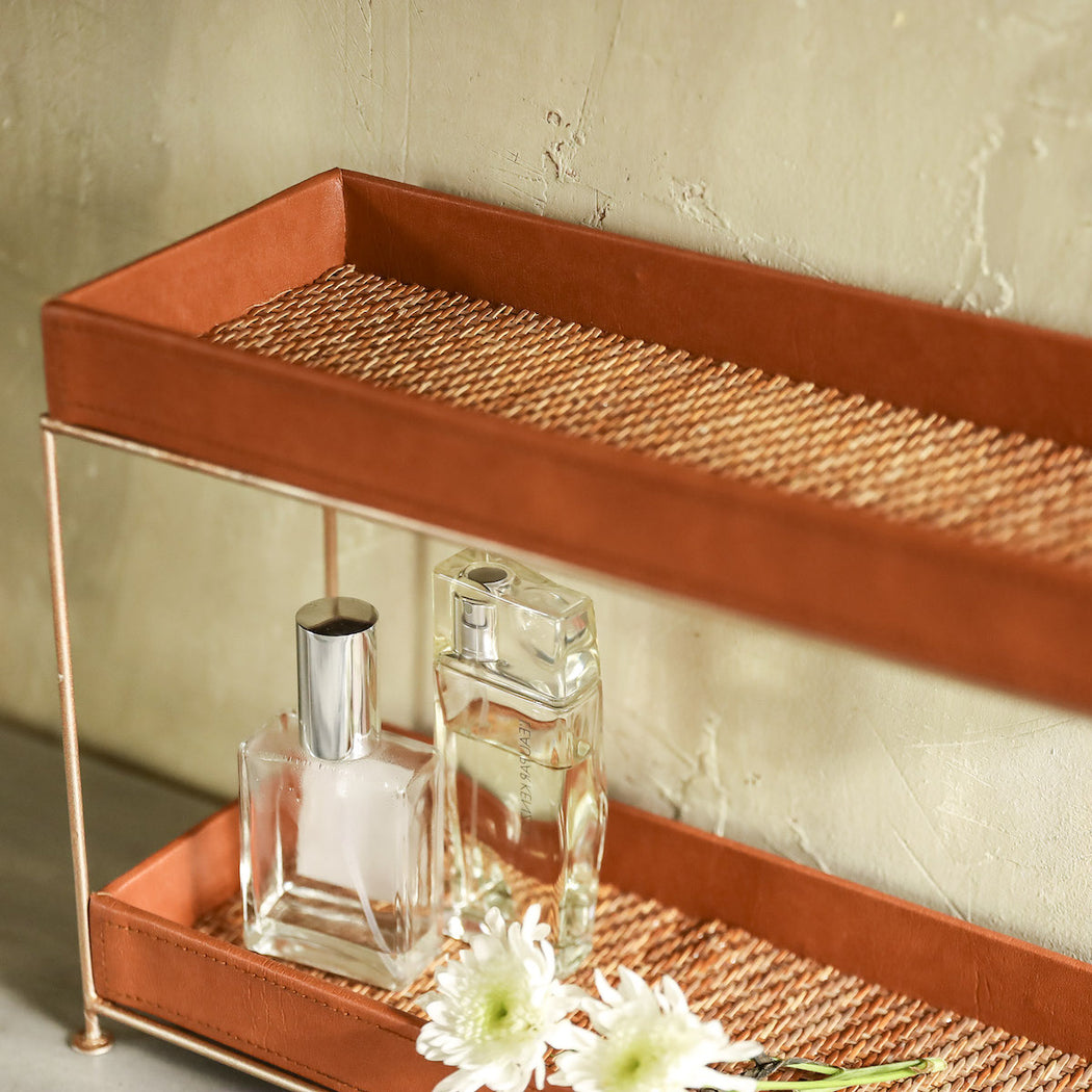 A space saving bathroom tray that stores all your essential toiletries, make-ups, and jewelries. Made in the Philippines from woven rattan mat, faux leather material, and wrought iron stand. 