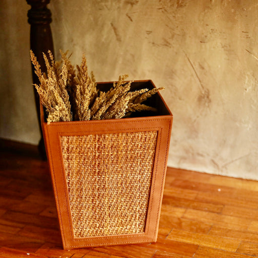 Our trash bin adds a natural touch to your bathroom while keeping it clean at all times.  Made in the Philippines from woven rattan mat and faux leather material.