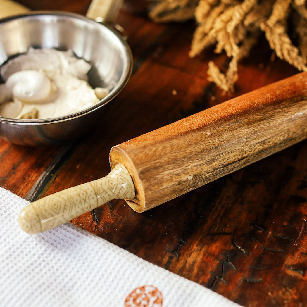 Roll with ease and style using this beautifully crafted wooden rolling pin with signature handles. The size and weight are perfect for working on all kinds of bread, pasta, and cookie doughs! Lovingly made in the Philippines. Home decor and baking essentials available online through Domesticity.